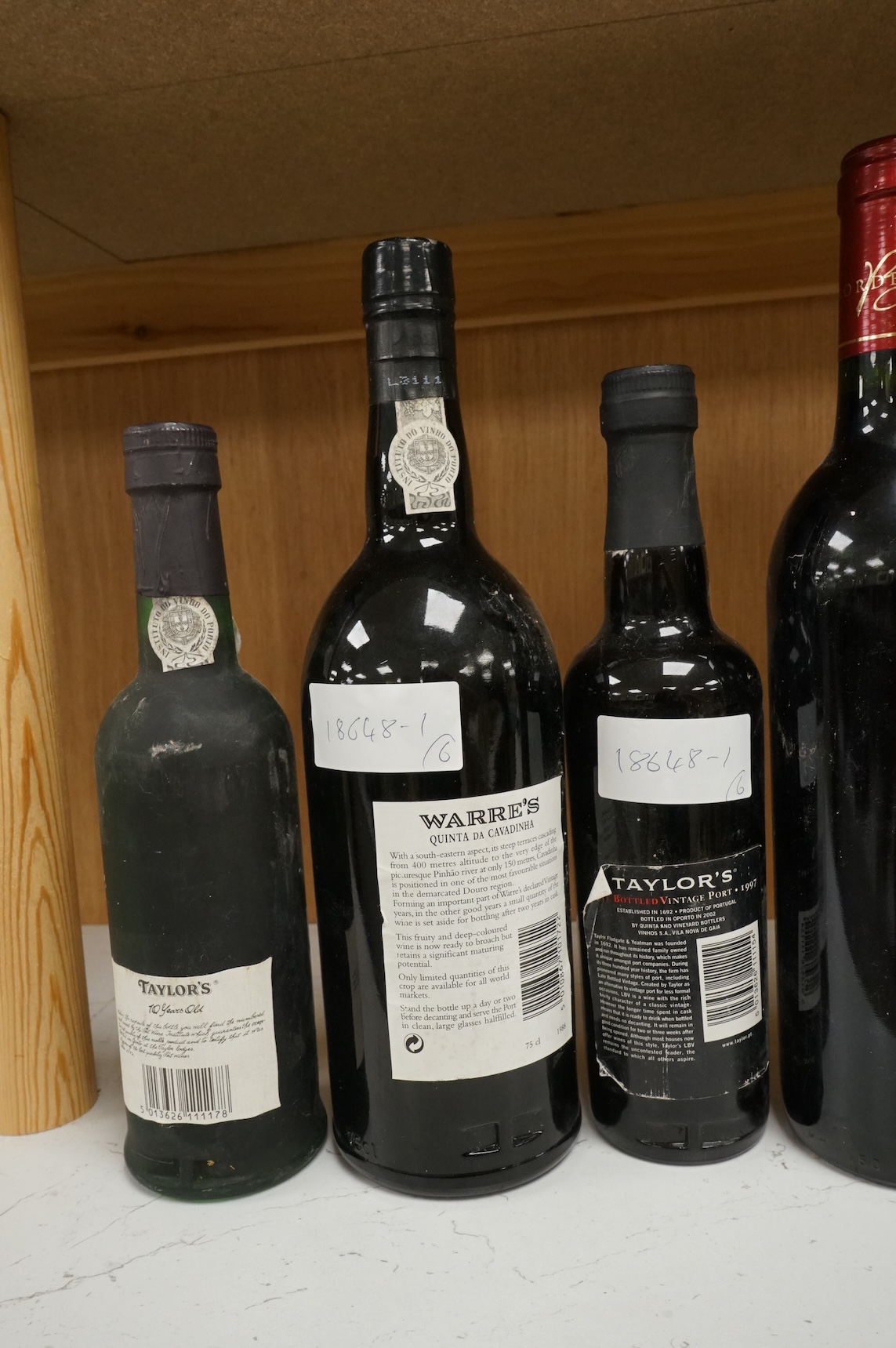 Two bottles of Warres 1988 vintage Port, a half bottle of Taylor's 1997, a Taylor's 10 year old Port, and two bottles of Chateau Lartigue, 2004